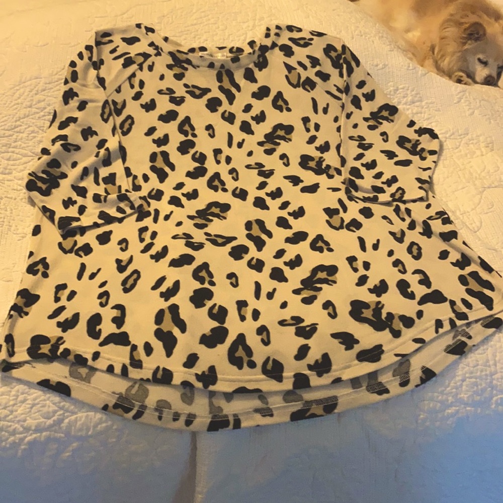 off white super soft leopard top with 3/4 sleeves.